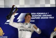Formula One - F1 - Singapore Grand Prix - Marina Bay, Singapore - 18/9/16. Mercedes' Nico Rosberg of Germany celebrates after winning the race. REUTERS/Jeremy Lee