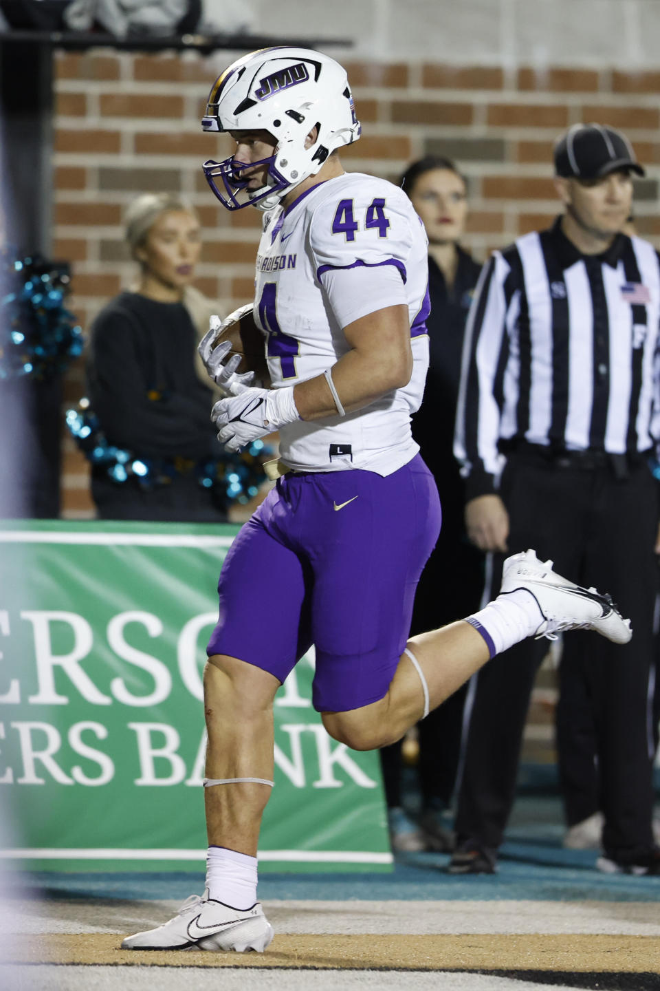 James Madison tight end Zach Horton scores a touchdown against Coastal Carolina during the second half of an NCAA college football game in Conway, N.C., Saturday, Nov. 25, 2023. (AP Photo/Nell Redmond)