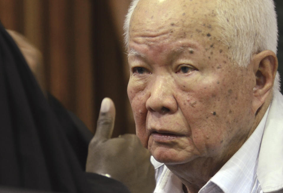 In this photo released by the Extraordinary Chambers in the Courts of Cambodia, Khieu Samphan, former Khmer Rouge head of state, sits in a court room before a hearing at the U.N.-backed war crimes tribunal in Phnom Penh, Cambodia, Friday, Nov. 16, 2018. The international tribunal to judge the criminal responsibility of former Khmer Rouge leaders for the deaths of an estimated 1.7 million Cambodians opened its session Friday to deliver its verdicts on charges of genocide and other crimes. (Nhet Sok Heng/Extraordinary Chambers in the Courts of Cambodia via AP)