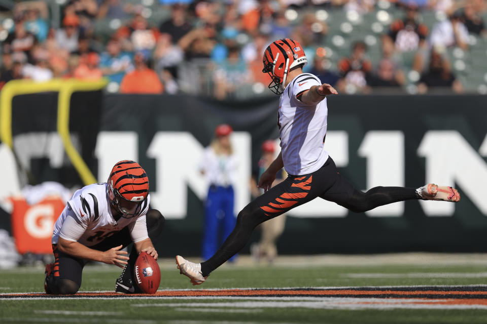 Cincinnati Bengals kicker Evan McPherson (2) kicks a field goal from the hold of Kevin Huber in the first half of an NFL exhibition football game against the Miami Dolphins in Cincinnati, Sunday, Aug. 29, 2021. (AP Photo/Aaron Doster)