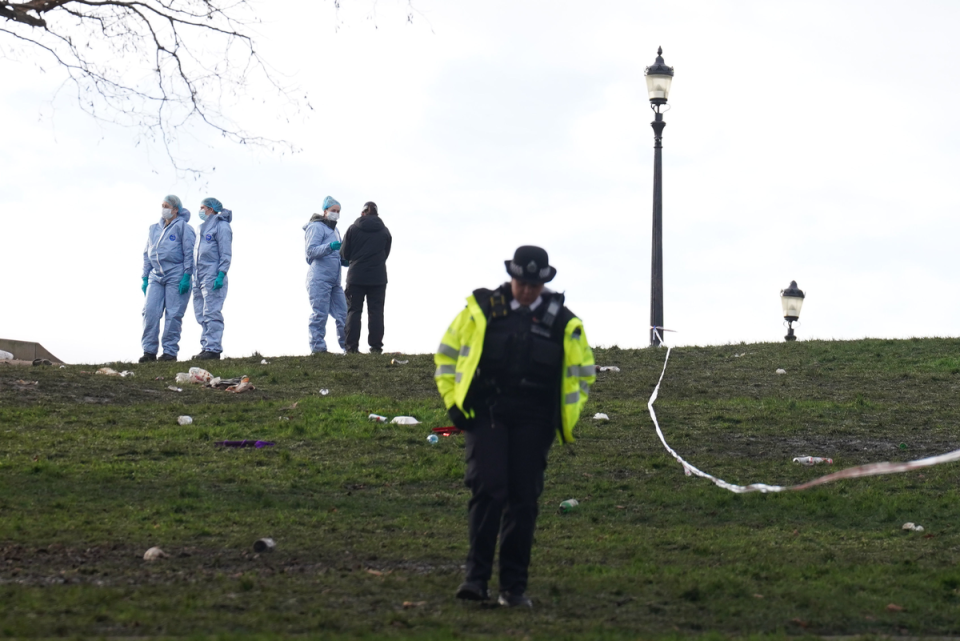 Police officers in forensic suits on Primrose Hill (PA)