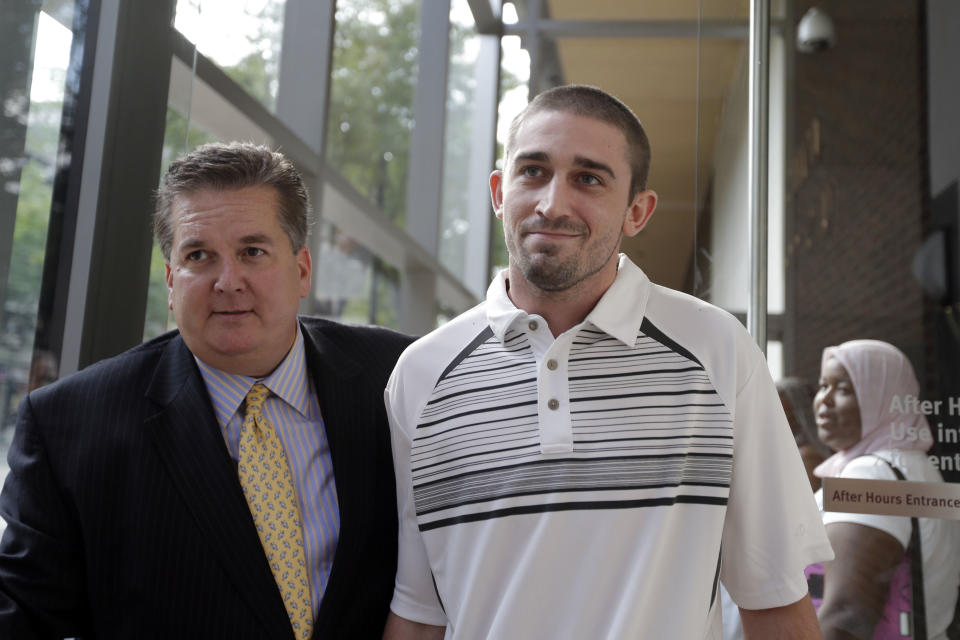 Kenneth W. Smith Jr., right, accompanied by his lawyer Bill Brennan walks near the U.S. Courthouse, Friday, Sept. 7, 2012, in Philadelphia. Smith was arrested and is charged with making a hoax threat that led authorities to recall a plane in midair to the Philadelphia airport. Federal authorities charged 26-year-old Smith Jr. with conveying false and misleading information. According to a criminal complaint, Smith called police at the airport on Thursday, Sept. 6, 2012 and falsely reported a passenger was carrying an explosive substance. Authorities then recalled a Dallas-bound US Airways flight to Philadelphia. (AP Photo/Matt Rourke)