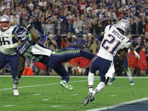 New England Patriots strong safety Malcolm Butler (21) intercepts a pass in front of Seattle Seahawks wide receiver Ricardo Lockette (83) during the second half of NFL Super Bowl XLIX football game Sunday, Feb. 1, 2015, in Glendale, Ariz. (AP Photo/Michael Conroy)