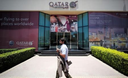 A man walks past Qatar Airways office in Manama, Bahrain, June 5, 2017. REUTERS/Hamad I Mohammed