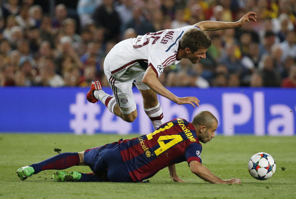 Football - FC Barcelona v Bayern Munich - UEFA Champions League Semi Final First Leg - The Nou Camp, Barcelona, Spain - 6/5/15 Bayern Munich's Thomas Muller is fouled by Barcelona's Javier Mascherano Reuters / Paul Hanna