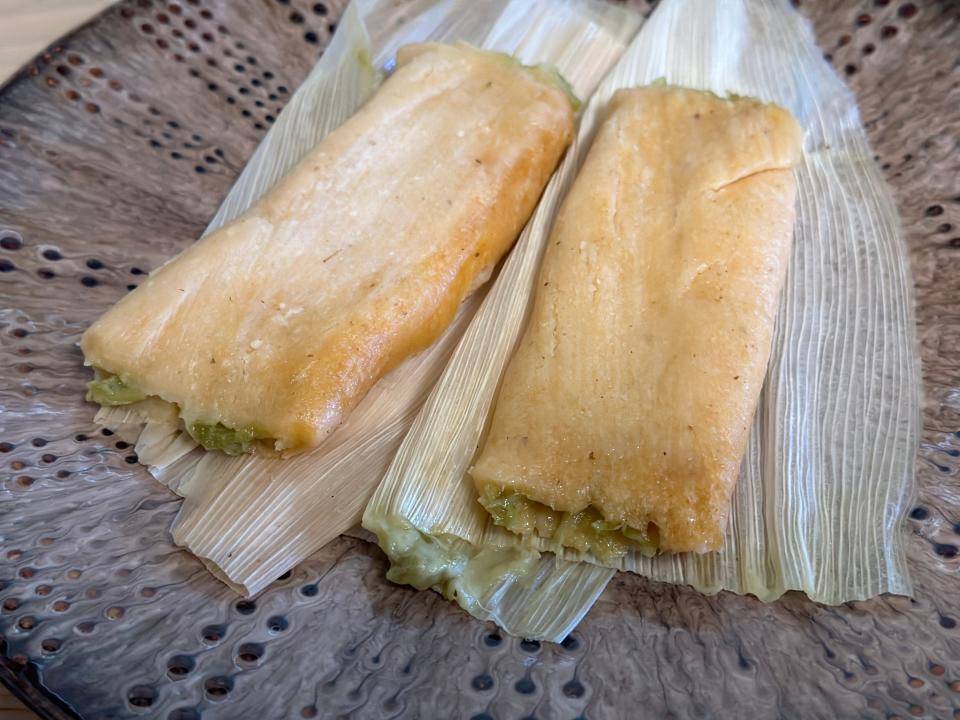 Unwrapped and plated Trader Joe's green chili tamales