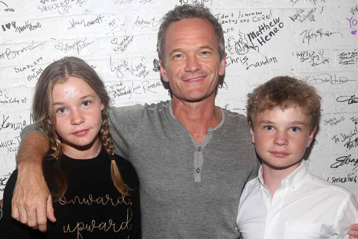 <p>Bruce Glikas/WireImage</p> Harper Grace Burtka-Harris, Neil Patrick Harris, Gideon Burtka-Harris pose backstage at the hit musical "Shucked" on Broadway at The Nederlander Theatre on September 9, 2023 