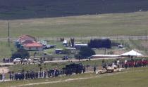 The funeral cortege carrying the coffin of former South African President Nelson Mandela, on a gun carriage, makes its way to the graveyard within the Mandela family's property in the village of Qunu December 15, 2013. REUTERS/Kai Pfaffenbach (SOUTH AFRICA - Tags: POLITICS OBITUARY TPX IMAGES OF THE DAY)