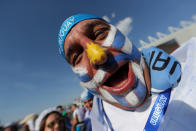 <p>A Uruguay fan celebrates as <em>La Celeste </em>booked their place in the knockout round </p>