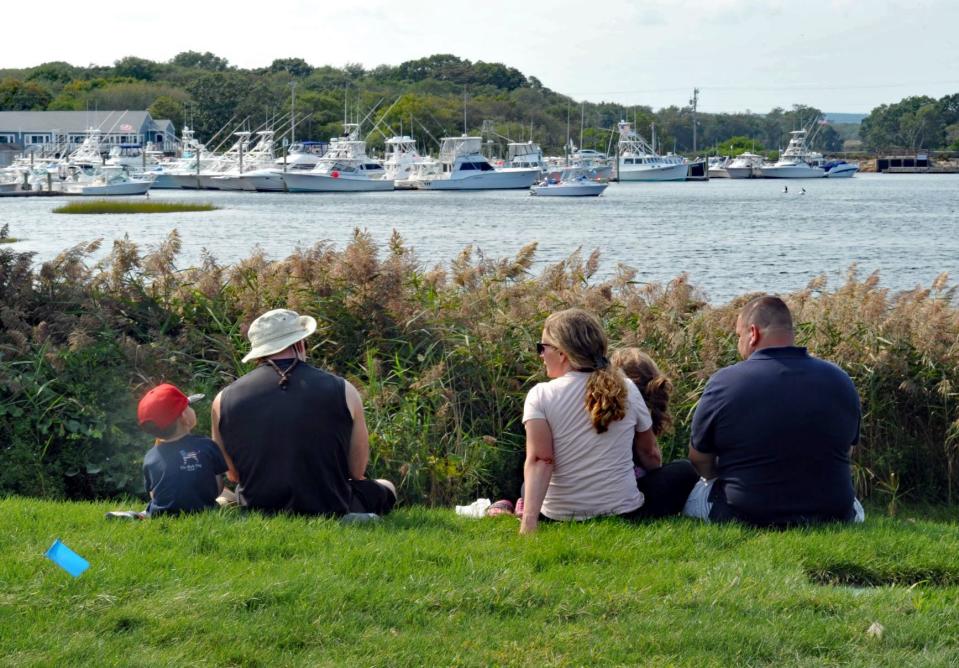 A family enjoys the view from Harbor Park during the Marshfield LobsterFest, Sunday, Sept. 12, 2021.