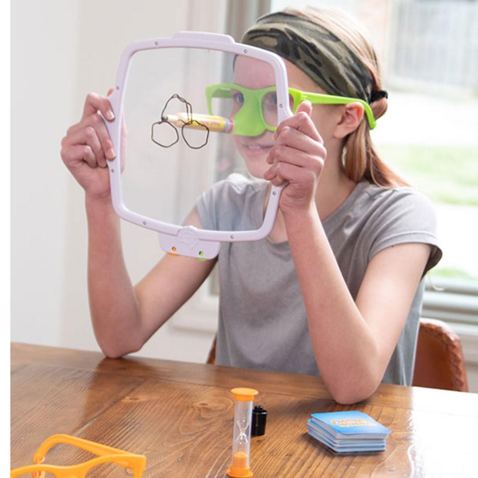 kid playing board game