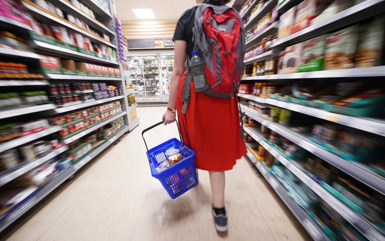 A shopper browses the aisles