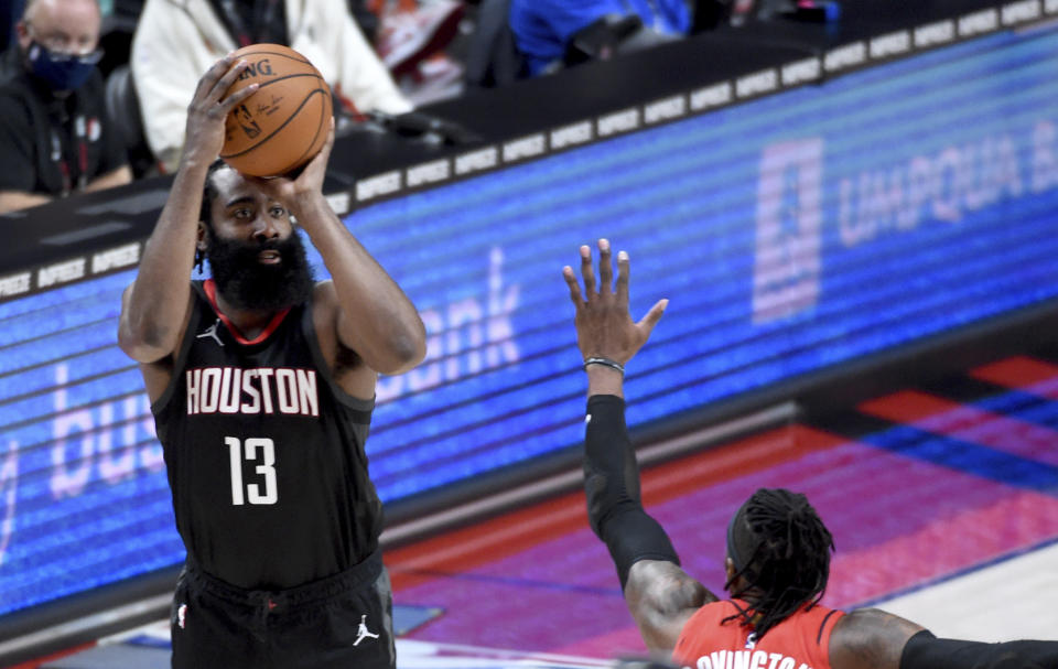 Houston Rockets guard James Harden shoots over Portland Trail Blazers forward Robert Covington during the second half of an NBA basketball game in Portland, Ore., Saturday, Dec. 26, 2020. The Blazers won 128-126 in overtime. (AP Photo/Steve Dykes)