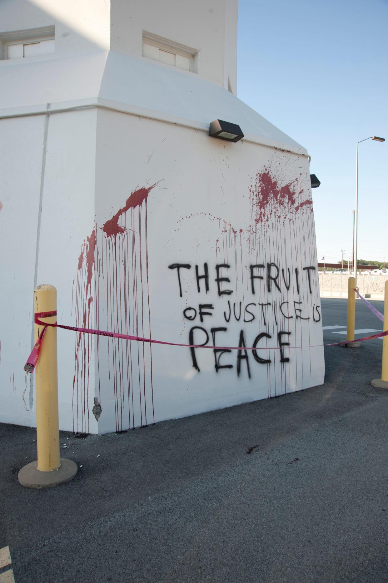 Spray-painted graffiti and human blood are seen on a building that stores bomb-grade uranium at the Y-12 nuclear weapons plant after the July 28, 2012, intrusion by anti-nuclear activists Michael R. Walli, Sister Megan Rice and Greg Boertje-Obed.