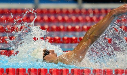 Michael Phelps swims to a first place finish in Heat 12 of the men's 200m Individual Medley on day five of the 2012 US Olympic Team Trials