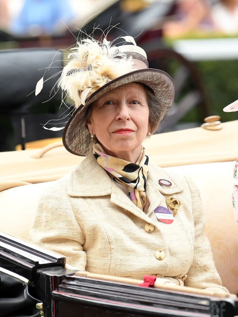 Princess Anne wears a feathered hat