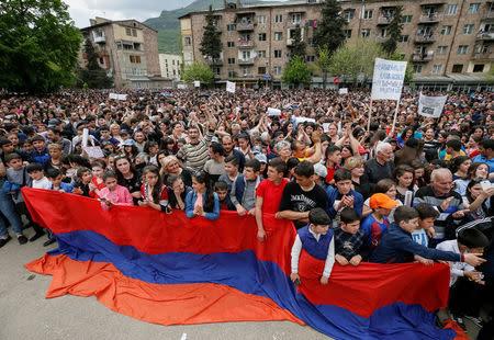 Supporters of Armenian opposition leader Nikol Pashinyan attend a rally in the town of Ijevan, Armenia April 28, 2018. REUTERS/Gleb Garanich