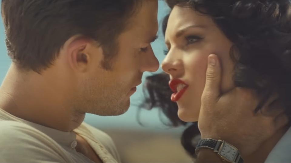 Scott Eastwood holding Taylor Swift's face in the Wildest Dreams video.