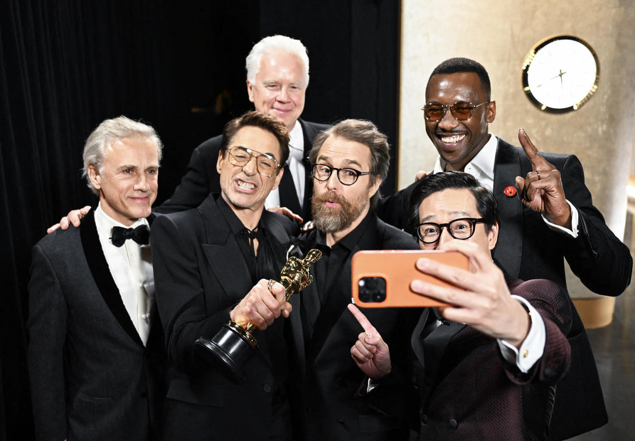 Christoph Waltz, Robert Downey Jr., Tim Robbins, Sam Rockwell, Mahershala Ali and Ke Huy Quan take a photo together backstage  (Richard Harbaugh / Getty Images)
