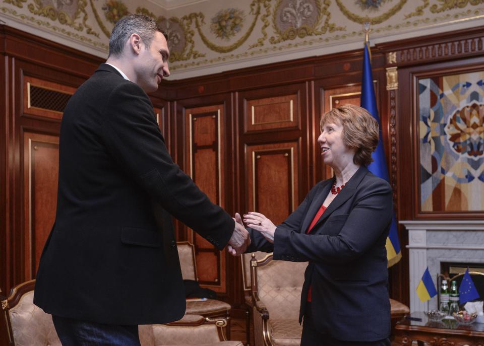 Ukrainian lawmaker and chairman of the Ukrainian opposition party Udar (Punch), former WBC heavyweight boxing champion Vitali Klitschko, left, shakes hands with EU foreign policy chief Catherine Ashton in Kiev, Ukraine, Monday, Feb. 24, 2014.The head of OSCE, the European security organization is proposing the establishment of an international contact group to support Ukraine in its difficult transition period.(AP Photo/Andrew Kravchenko, pool)