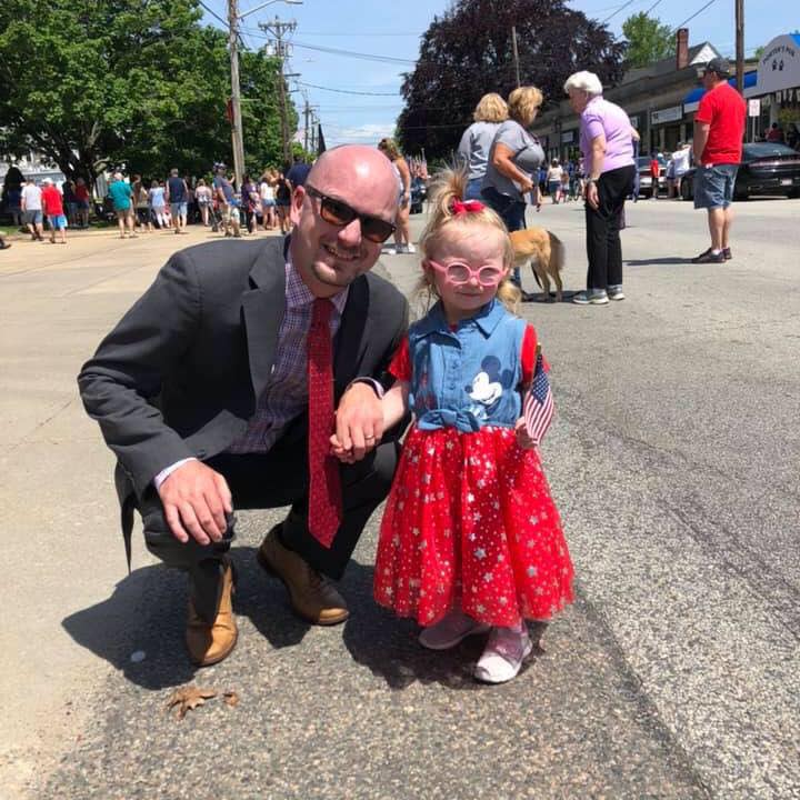 Dighton’s outgoing town administrator Michael Mullen Jr. enjoys a parade with his daughter Clara several years ago.