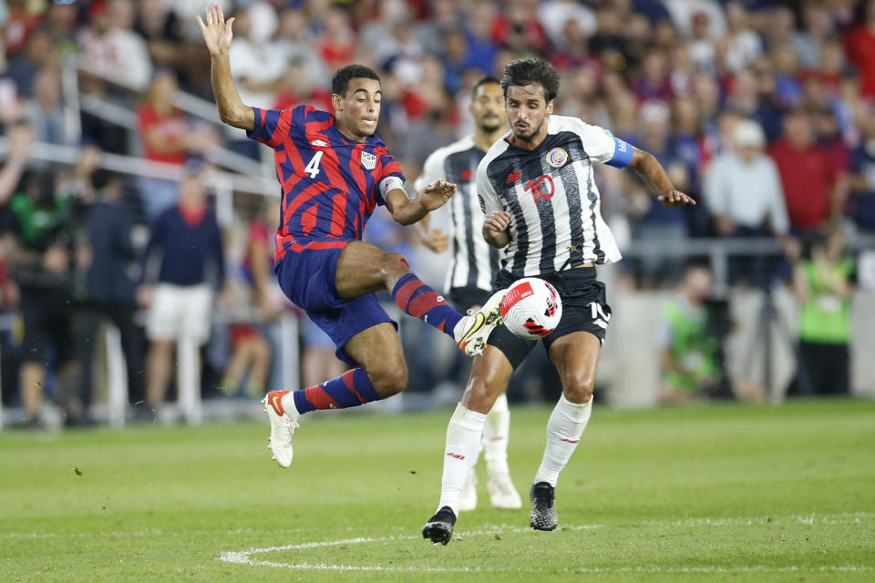 United States' Tyler Adams, left, and Costa Rica's Bryan Ruiz chase the ball during the second half of a World Cup qualifying soccer match Wednesday, Oct. 13, 2021, in Columbus, Ohio. The United States won 2-1. (AP Photo/Jay LaPrete)