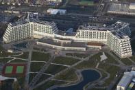 An aerial view from a helicopter shows AZIMUT Hotel Resort and SPA Sochi in the Adler district of the Black Sea resort city of Sochi, December 23, 2013. Sochi will host the 2014 Winter Olympic Games in February. Picture taken December 23, 2013. REUTERS/Maxim Shemetov (RUSSIA - Tags: CITYSCAPE SPORT OLYMPICS TRAVEL)