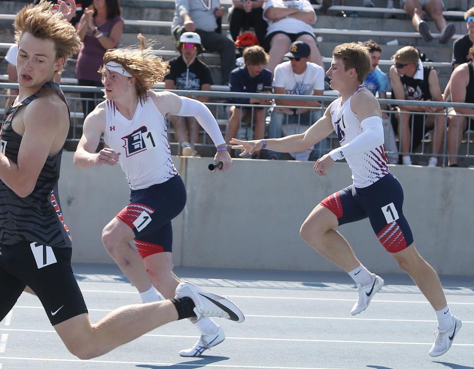 Ballard's Eli Rouse and Jakson Fleischmann exchange the baton during the 3A boys 4x400-meter relay on the final day of the Iowa high school track and field meet at Drake Stadium.