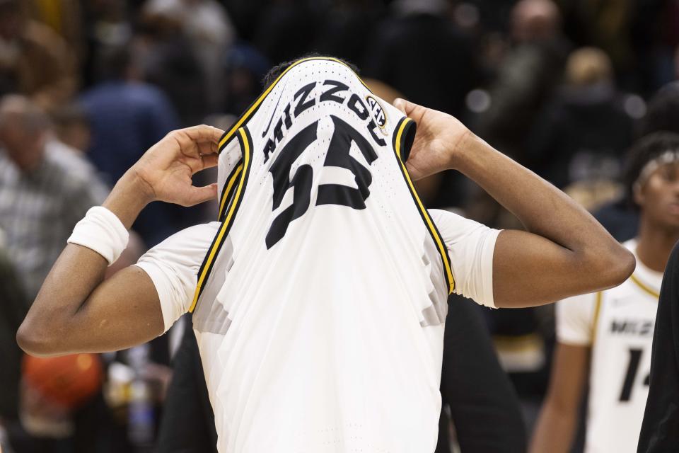 Missouri's Sean East II covers his face after losing to South Carolina 71-69 in overtime of an NCAA college basketball game Saturday, Jan. 13, 2024, in Columbia, Mo. (AP Photo/L.G. Patterson)