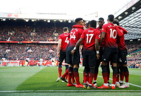 Soccer Football - Premier League - Manchester United v West Ham United - Old Trafford, Manchester, Britain - April 13, 2019 Manchester United's Paul Pogba celebrates scoring their second goal with team mates Action Images via Reuters/Carl Recine