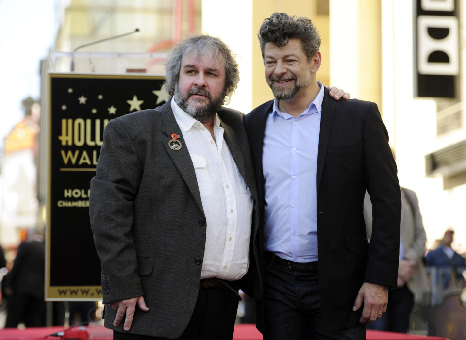 FILE - Peter Jackson, left, director, co-writer and producer of the film trilogies "The Lord of the Rings and "The Hobbit," poses with actor Andy Serkis during a ceremony honoring Jackson with a star on the Hollywood Walk of Fame in Los Angeles on Dec. 8, 2014. (Photo by Chris Pizzello/Invision/AP, File)