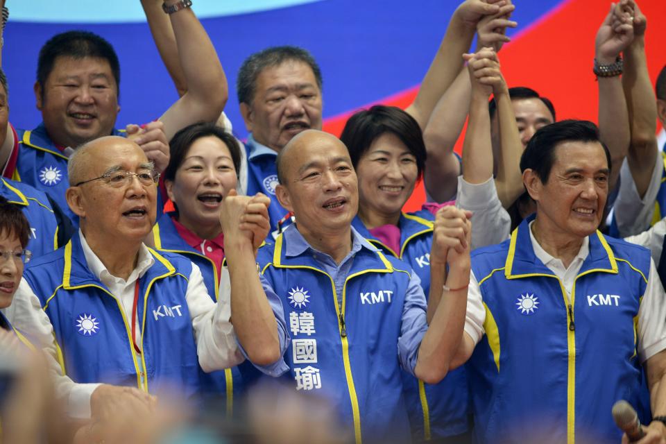 Kuomintang (KMT) party's presidential candidate Han Kuo-yu (C) gestures while posing with party dignitaries during the KMT national congress in Taipei on July 28, 2019. - Taiwan's upcoming elections will be a "heart-pounding, soul-stirring battle" for the island's future, Beijing-friendly candidate Han Kuo-yu said July 28 in his first speech since becoming the opposition party's presidential candidate. (Photo by Chris STOWERS / AFP)        (Photo credit should read CHRIS STOWERS/AFP/Getty Images)