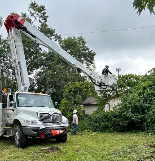 An AEP Ohio crew works to repair power lines damaged by thunderstorms that moved through the state on Monday.