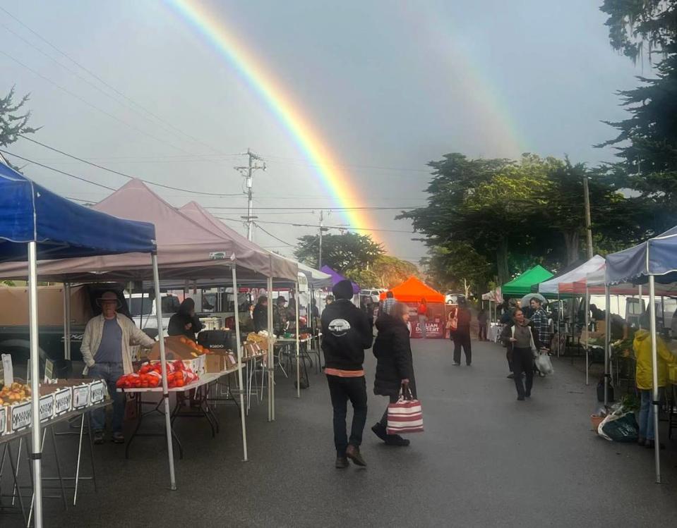 A double rainbow forms over the farmers market in Baywood Park.