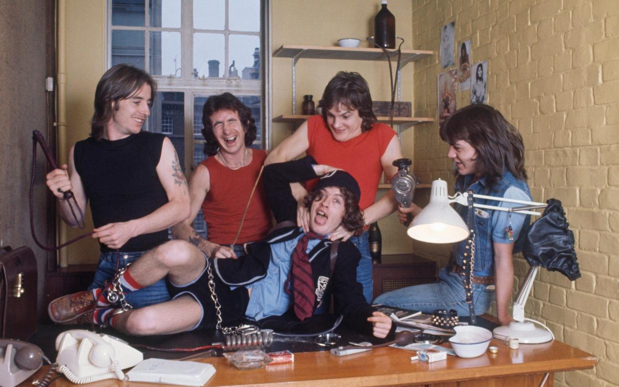 AC/DC (Phil Rudd, Bon Scott, Angus Young, Mark Evans, Malcolm Young) in 1976 - Getty