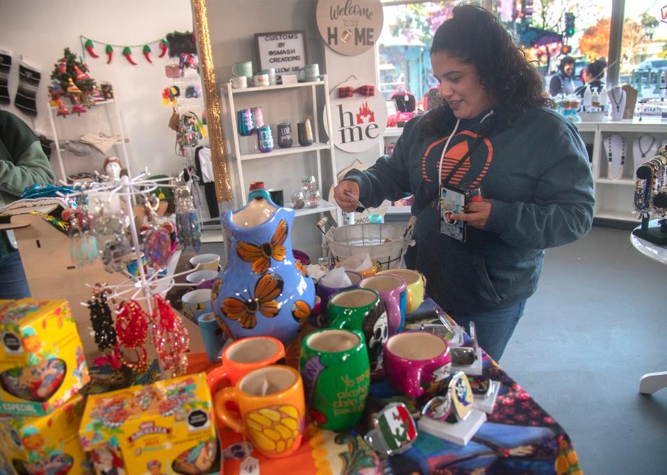 (11/27/21) Angelina Garcia shops at the Sweet Life Boutique during the Miracle MIle's Sip and Stroll wine tasting/shopping event in Stockton. CLIFFORD OTO/THE STOCKTON RECORD