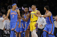 Oklahoma City Thunder guard Josh Giddey (3) and forward Kenrich Williams (34) break up Oklahoma City Thunder forward Darius Bazley (7) and Los Angeles Lakers guard Russell Westbrook (0) during the second half of an NBA basketball game, Wednesday, Oct. 27, 2021, in Oklahoma City. (AP Photo/Garett Fisbeck)