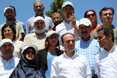 Pro-Kurdish Peoples' Democratic Party (HDP) lawmakers gather at a park for a party meeting in Diyarbakir, Turkey, July 25, 2017. REUTERS/Sertac Kayar