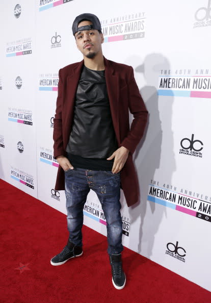 J. Cole arrives on the 2012 American Music Awards red carpet.