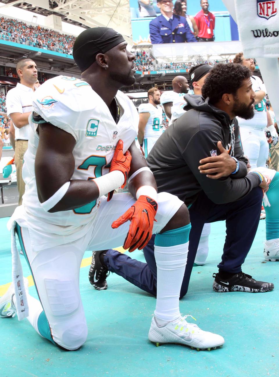 <p>Miami Dolphins free safety Michael Thomas (31) kneels during the National Anthem at the start of an NFL football game against the Cleveland Browns, Sunday, Sept. 25, 2016, in Miami Gardens, Fla. (AP Photo/Marta Lavandier) </p>
