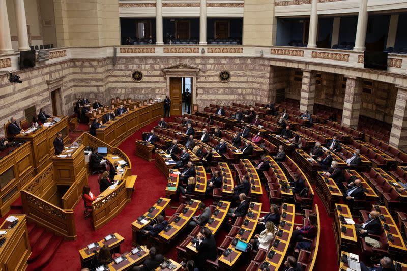 Greek PM Mitsotakis addresses lawmakers during a parliamentary session on revelations of abuse in arts and sports, in Athens