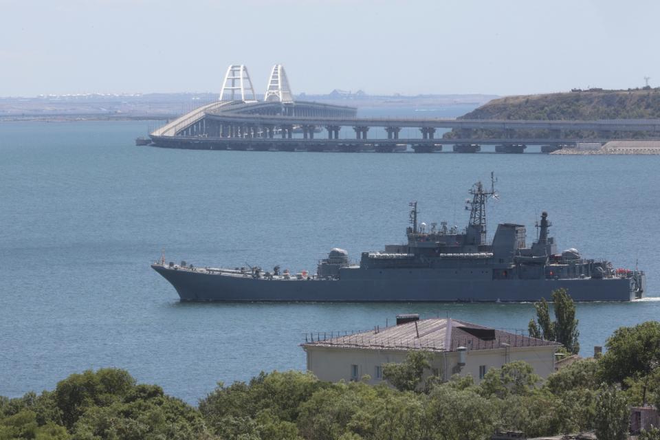 A Russian military large landing ship, which now transports cars and people between Crimea and Taman because the Crimean Bridge connecting Russian mainland and Crimean peninsula over the Kerch Strait is closed, sails not far from Kerch, Crimea, on Monday, July 17, 2023. An attack before dawn damaged part of a bridge linking Russia to Moscow-annexed Crimea that is a key supply route for Kremlin forces in the war with Ukraine. The strike Monday has forced the span's temporary closure for a second time in less than a year. (AP Photo)