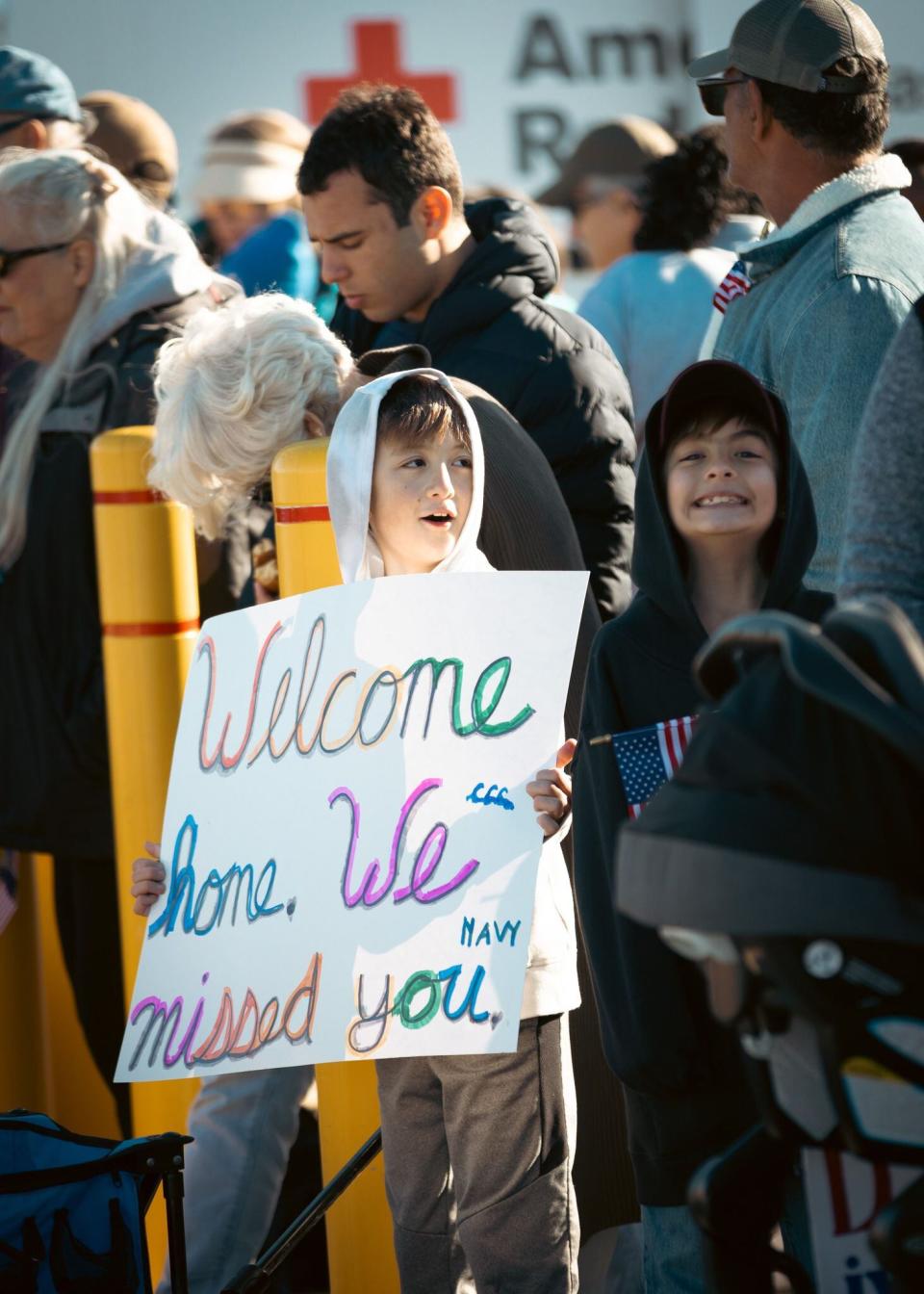 Families gather at the docks for the return home of their loved ones at Naval Station Mayport.