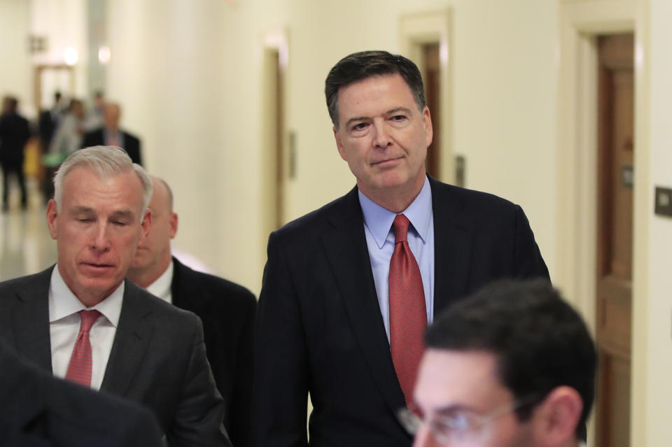 Former FBI Director James Comey, right, with his attorney, David Kelley, left, leaves Capitol Hill in Washington, Monday, Dec. 17, 2018, after a second closed-door interview with two Republican-led committees investigating what they say was bias at the Justice Department before the 2016 presidential election. (AP Photo/Manuel Balce Ceneta)