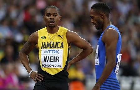 Athletics - World Athletics Championships - Men's 200 Metres Heats - London Stadium, London, Britain – August 7, 2017. Warren Weir of Jamaica and Jeremy Dodson of Samoa react after a heat. REUTERS/Phil Noble