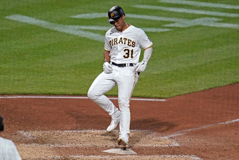Pittsburgh Pirates' Cal Mitchell crosses home plate after hitting a solo home run off Philadelphia Phillies relief pitcher Jose Alvarado during the seventh inning of a baseball game in Pittsburgh, Saturday, July 30, 2022. (AP Photo/Gene J. Puskar)
