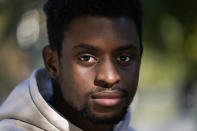 Illinois Institute of Technology student Wofai Ewa, originally from Nigeria, poses for a portrait Friday, Sept. 18, 2020, near the institute in Chicago. America was always considered the premiere destination for international students, with the promise of top-notch universities and work opportunities. Yet, 2016 marked the start of an alarming decline of new enrollees, something expected to continue with fresh rules limiting student visas, competition from other countries and a haphazard coronavirus response. (AP Photo/Charles Rex Arbogast)