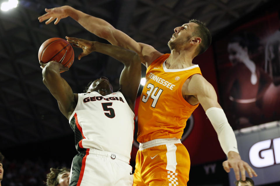 Tennessee forward Uros Plavsic (34) blocks a shot from Georgia's Anthony Edwards (5) during the first half of an NCAA college basketball game Wednesday, Jan. 15, 2020, in Athens, Ga. (Joshua L. Jones/Athens Banner-Herald via AP)