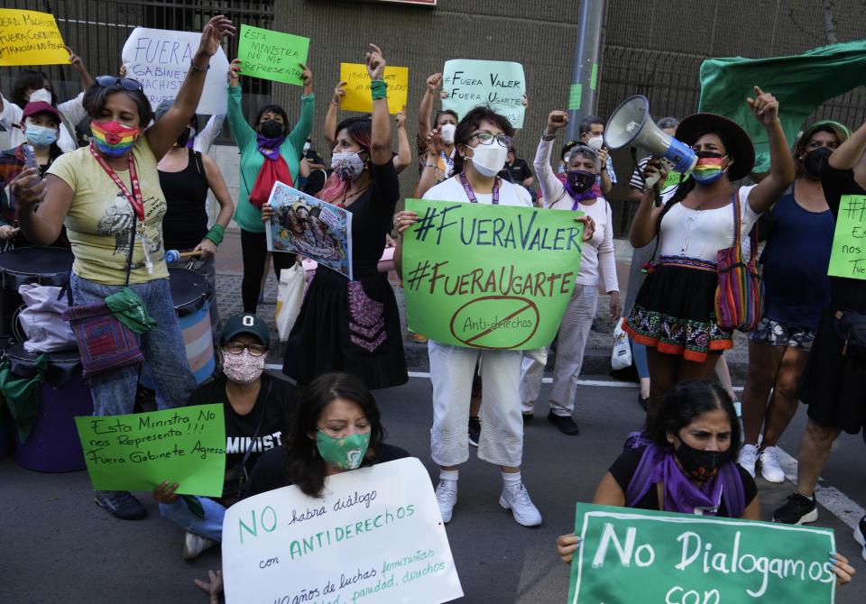 Feminist groups protest against what they call a "machista" and corrupt Cabinet of Peru’s President Pedro Castillo, outside the Ministry of Women, in Lima, Peru, Friday, Feb. 4, 2022. The women called out Peru’s newly appointed prime minister Hector Valer, head of the Cabinet, who has been accused of domestic violence against his wife and daughter. Valer has denied the accusations. (AP Photo/Martin Mejia)