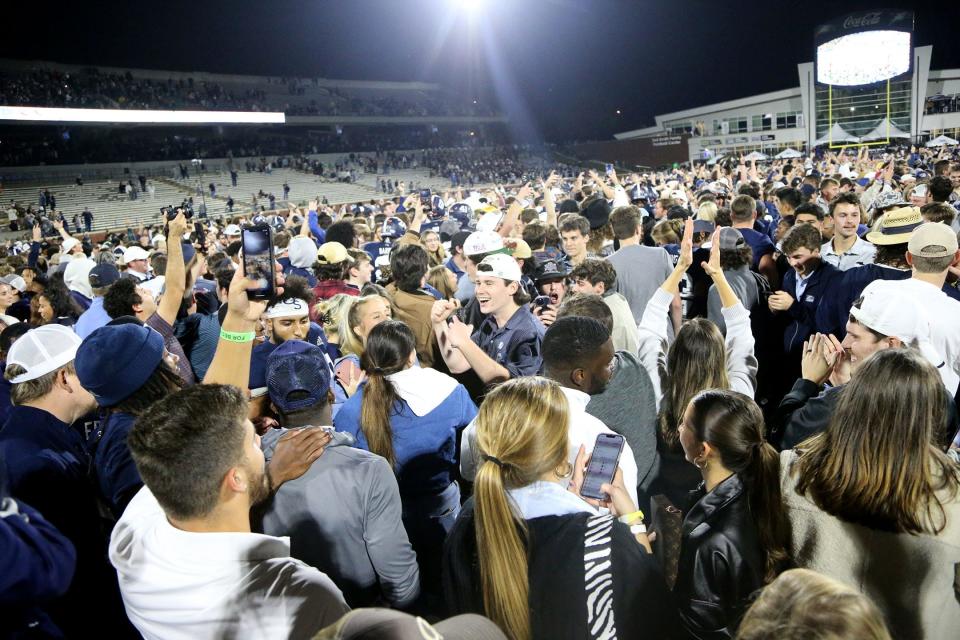 Georgia Southern fans celebrate on the field following Saturday's 51-48 double overtime win over Appalachian State.